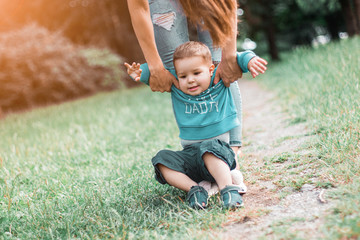 Mother play with son in the park.