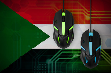 Sudan flag  and two mice with backlight. Online cooperative games. Cyber sport team