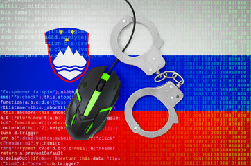 Slovenia flag  and handcuffed computer mouse. Combating computer crime, hackers and piracy