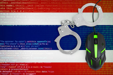 Thailand flag  and handcuffed computer mouse. Combating computer crime, hackers and piracy