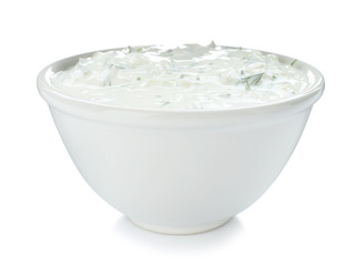 Bowl with cucumber sauce on white background