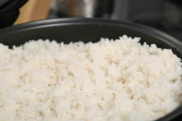 Modern cooker with fresh boiled rice, closeup