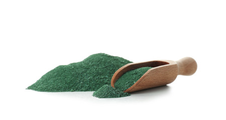 Scoop with spirulina algae powder on white background