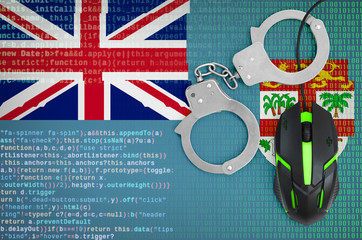 Fiji flag  and handcuffed computer mouse. Combating computer crime, hackers and piracy