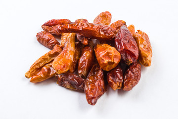 heap of piri piri peppers isolated on white background