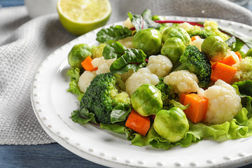 Plate of salad with Brussels sprouts on table, closeup