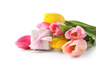Obraz na płótnie Canvas Beautiful spring tulips and gift box on white background. International Women's Day