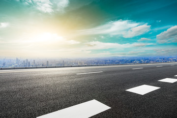 Fototapeta premium Panoramic city skyline and buildings with empty asphalt road in Shanghai