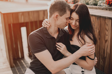 Loving couple hugging in the street.