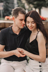 Loving couple hugging in the street.