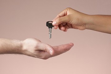 Hand giving a key