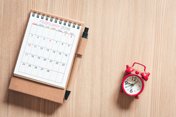 Calendar Annual With a Pen and Pocket Watch of Appointment on a Table Wooden Background. Schedule Appointment for Travel Planning Concept.