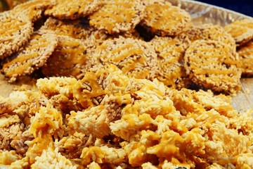 Khanom Nang Let, Crispy rice or Thai Rice Cracker, Snack made of rice, dried and Deep fried in oil.