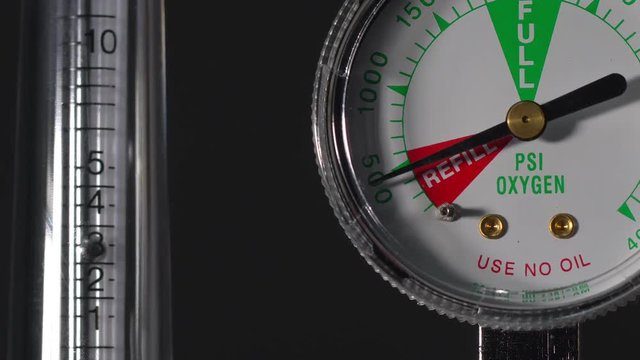 Close-up of medical oxygen flow meter  shows low oxygen or an nearly empty tank
