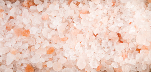 Himalayan pink salt background. Natural seasoning texture.