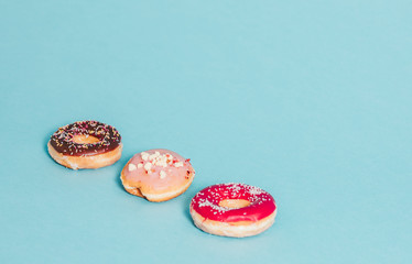 Three donuts on blue