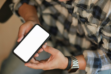 Blank screen mobile phone for graphic display montage in man hands