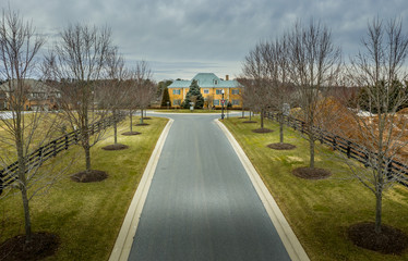 Aerial panorama of American luxury real estate neighborhood in Maryland with single family houses, mansions, high quality buildings with lot of land