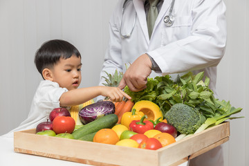 Healthy and nutrition concept. Kid learning about nutrition with doctor to choose eating fresh...
