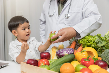 Healthy and nutrition concept. Kid learning about nutrition with doctor to choose eating fresh fruits and vegetables.