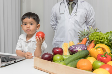 Healthy and nutrition concept. Kid learning about nutrition with doctor to choose eating fresh fruits and vegetables.