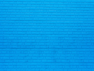 Brick wall. The brick wall painted in blue, close up
