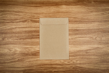 Brown envelope on wooden table