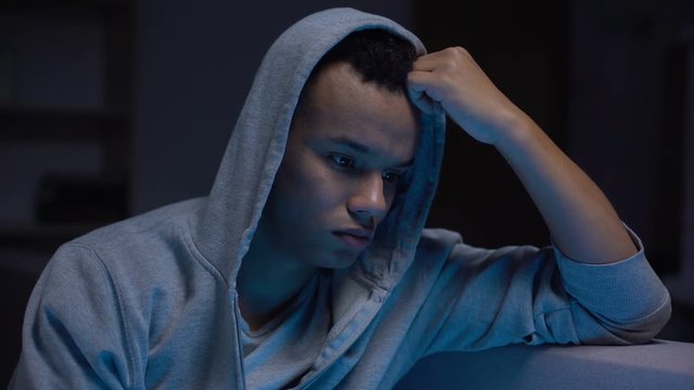 Black teenager feeling lonely, problems with communication, depression