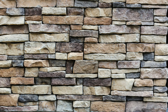 the stone wall texture background natural color.Background of stone wall texture photo.Natural stone wall texture for background.Old Brick texture, Grunge brick wall background.