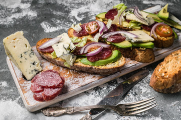 Italian bruschetta with smoked sausage and cheese.