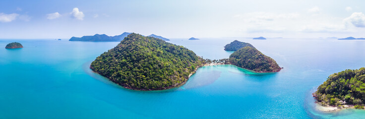 Aerial panorama of tropical island landscape surrounded by transparent turquoise water, paradise holidays vacation beach destination, warm sunny summer