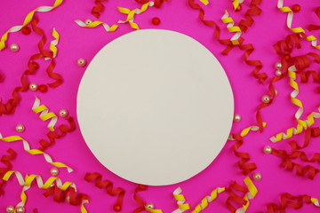 Flat Lay colorful celebration background with confetti on Pink background