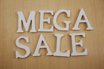 Mega Sale alphabet letters on wooden background business concept