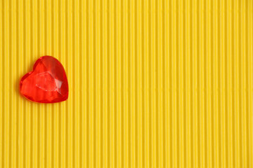 red heart on yellow background on left side, sign of love and romance, greeting card for womens day...
