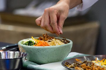 Bibimbap, Traditional Korean cusine bibimbap, Chef preparing Korean food, chef cooking in kitchen