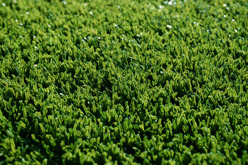 Abstract close up fake grass astro turf background lawn texture