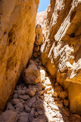 Interesting shapes trails surrounded by caves, rocks, cliffs of ancient cooper mines canyons and mountains range in Timna National Park