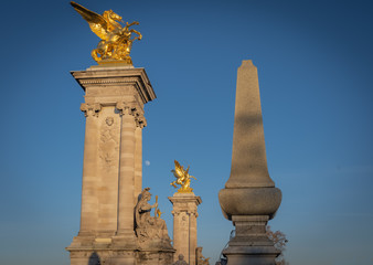 Fototapeta na wymiar Paris, France - 02 17 2019: Details of the Alexander III bridge and the moon