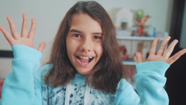 peek a boo. little girl covered her eyes face with her hands hide-and-seek lifestyle waiting for a surprise. slow motion video. teen girl playing bo-peep. childhood concept game hy - spy