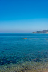 Fototapeta na wymiar Blue Mediterranean Sea on the Southern Italian Coast on a Sunny Day