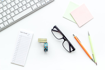 Education concept. Work desk of student. Computer keyboard and stationery on white background top view