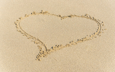Heart Drawn into the Sand on a Beach on a Sunny Day
