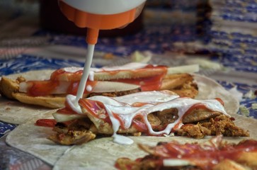 Kebab process Giving Mayonnaise on Table