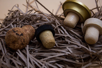 Four corks on a cut paper, light background