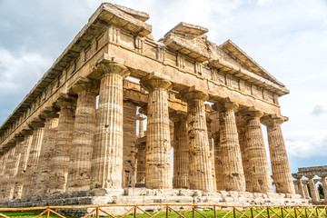 Obraz premium Ancient Greek Temple in the Ruins of a Village in Southern Italy