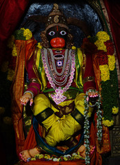 Closeup view of Hindu god Hanuman stone carved statue,decoration during festival in a temple 