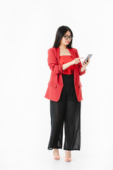 Asian woman in casual dress hold smartphone in her hand.