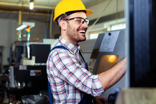 Worker operating CNC machine center