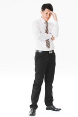 Half-length portrait of middle aged, handsome, Asian, businessman, in white shirt, striped tie.suffer from acute migraine, grimace, frown, painful from headache, on isolated white background