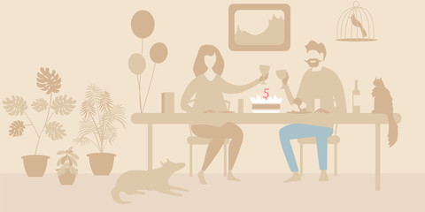 the couple celebrates the holiday at the table. man and woman celebrating the anniversary